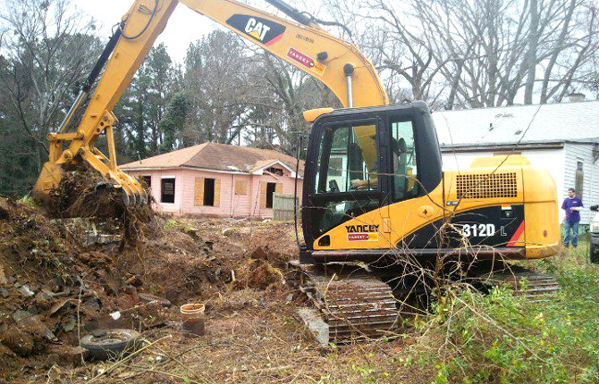 Backfilling a retaining wall