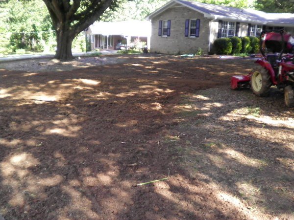 Roto tilling a front yard